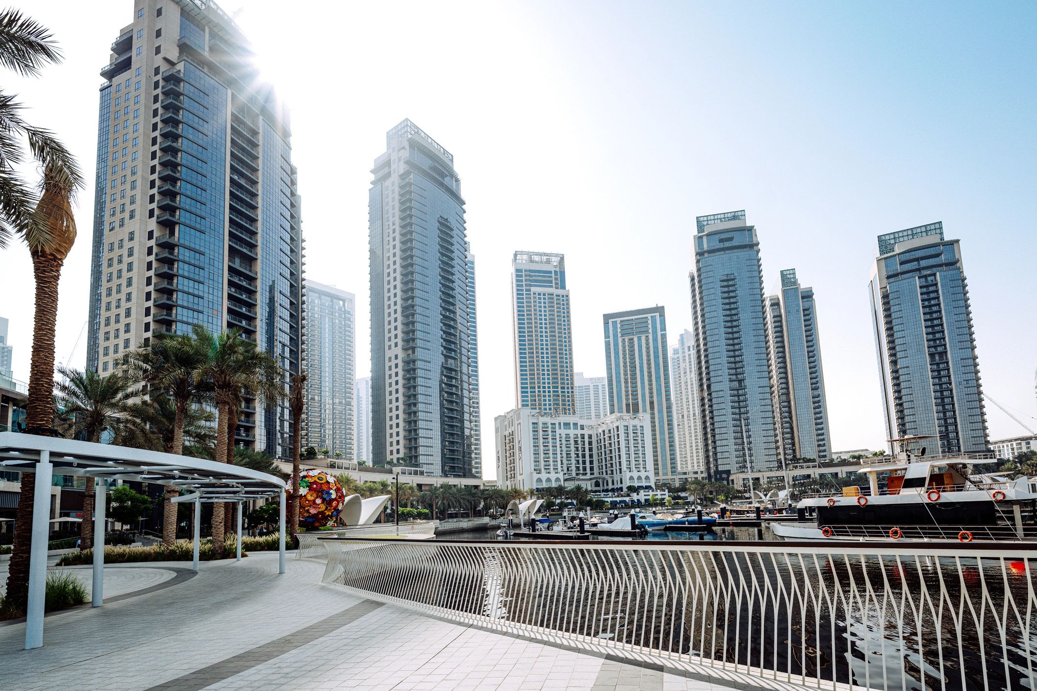 Dubai Marina skyline with waterfront promenade and yachts