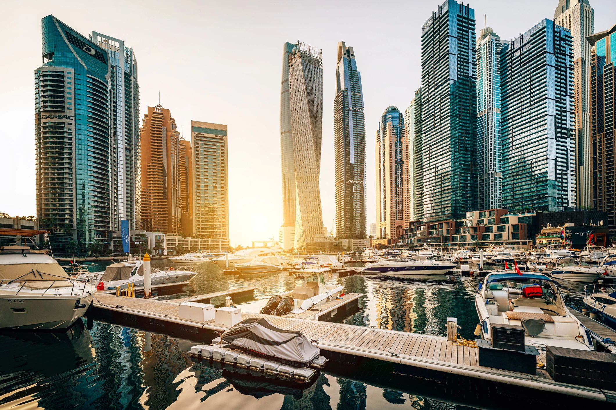 Dubai Marina skyline and yachts at sunset