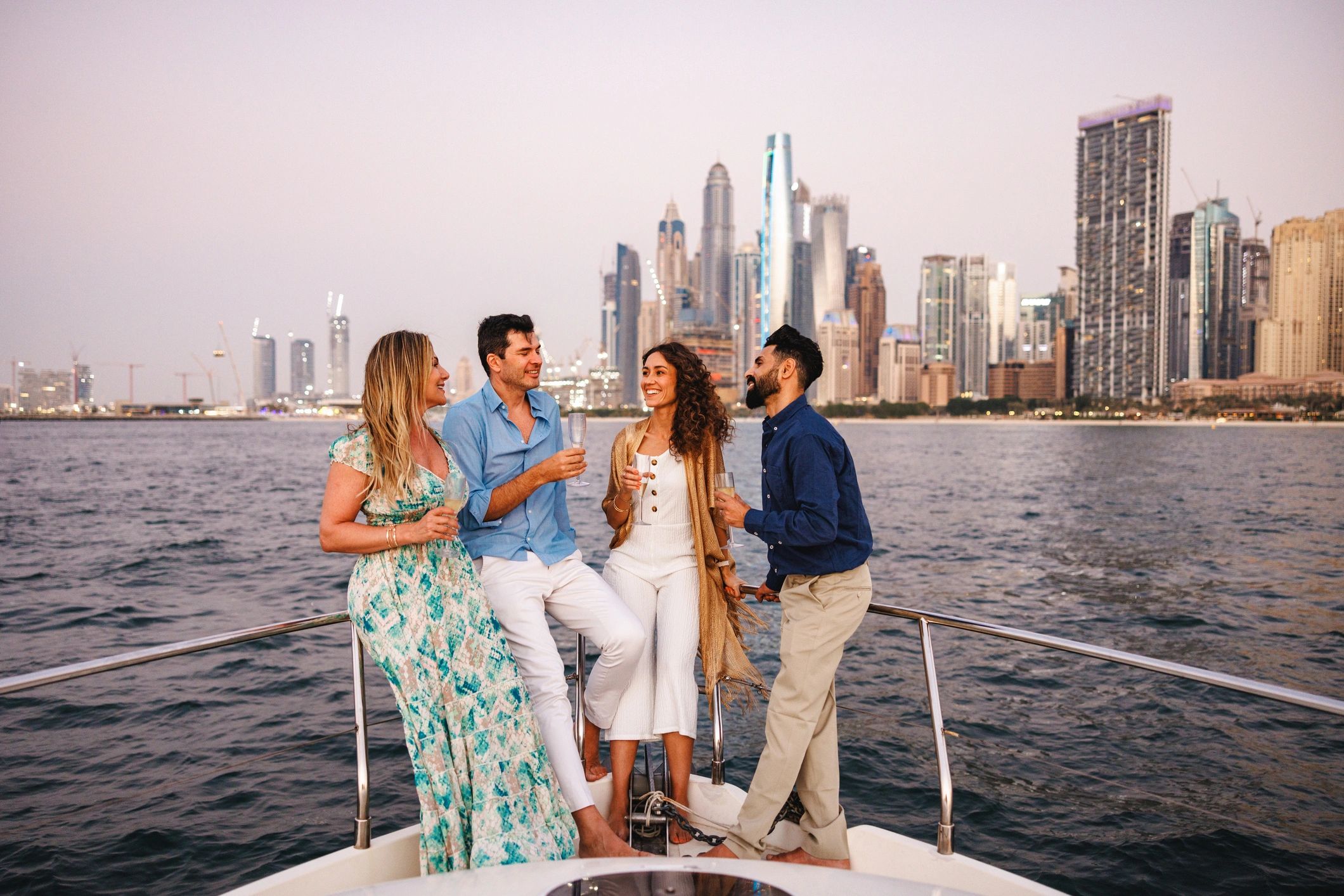 Guests enjoying a yacht cruise at sunset in Dubai
