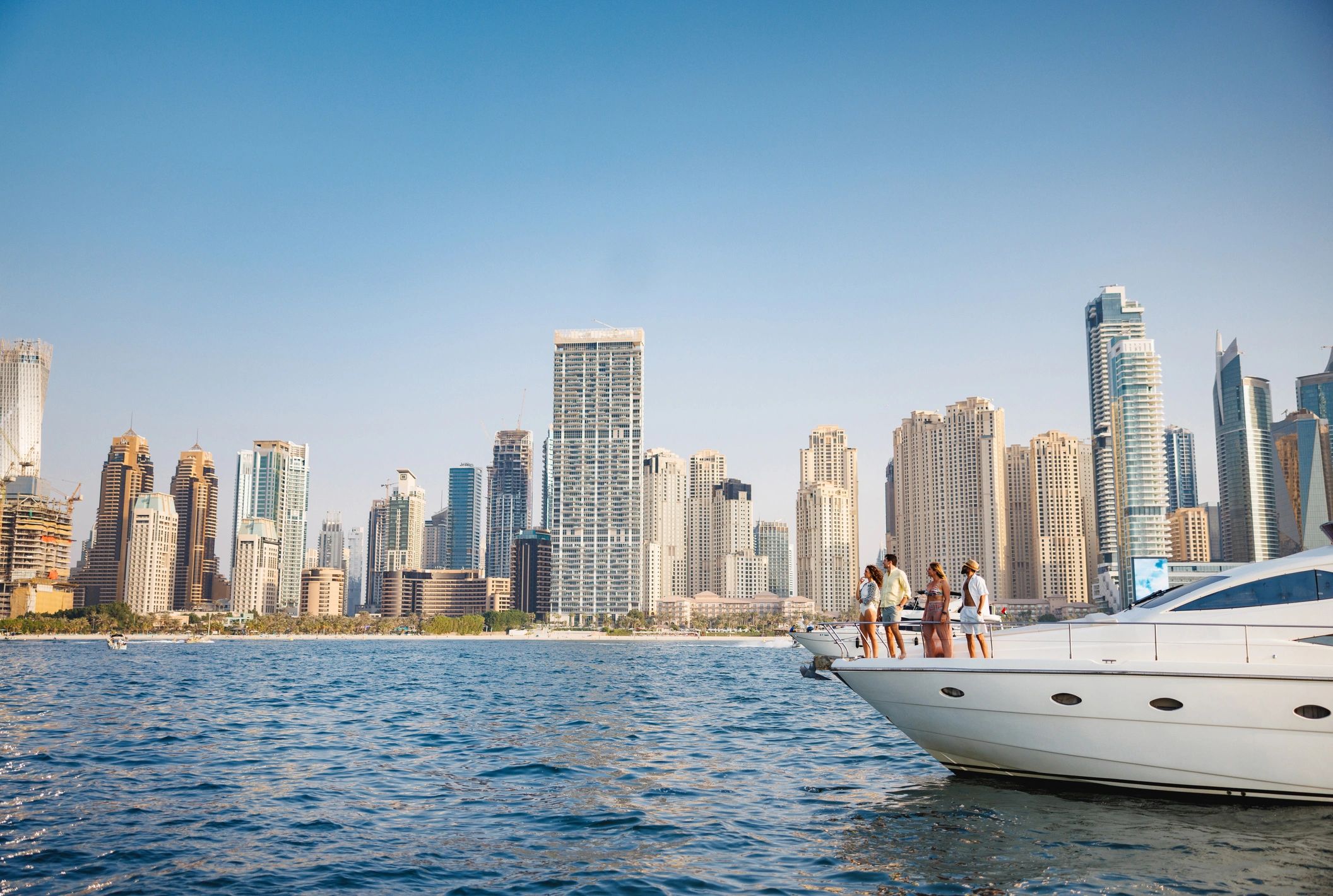 Corporate group on a yacht with Dubai skyline