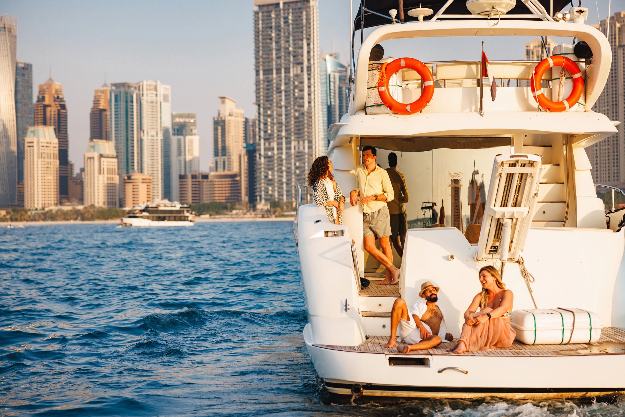 Friends relaxing on a luxury yacht in Dubai Marina