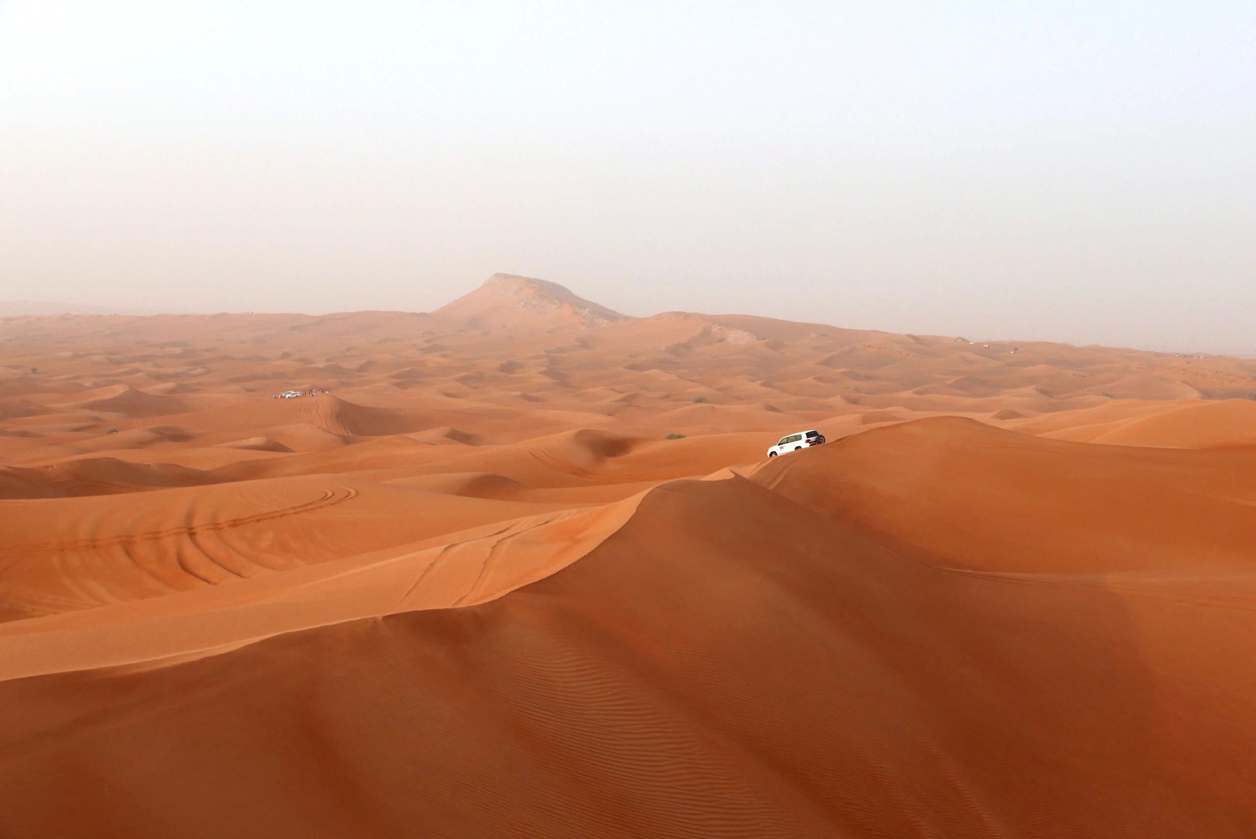 Dubai desert dunes with SUV